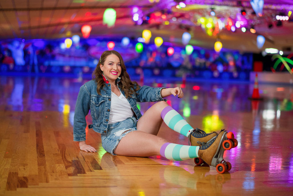 compression socks worn by a beautiful woman in a skating rink