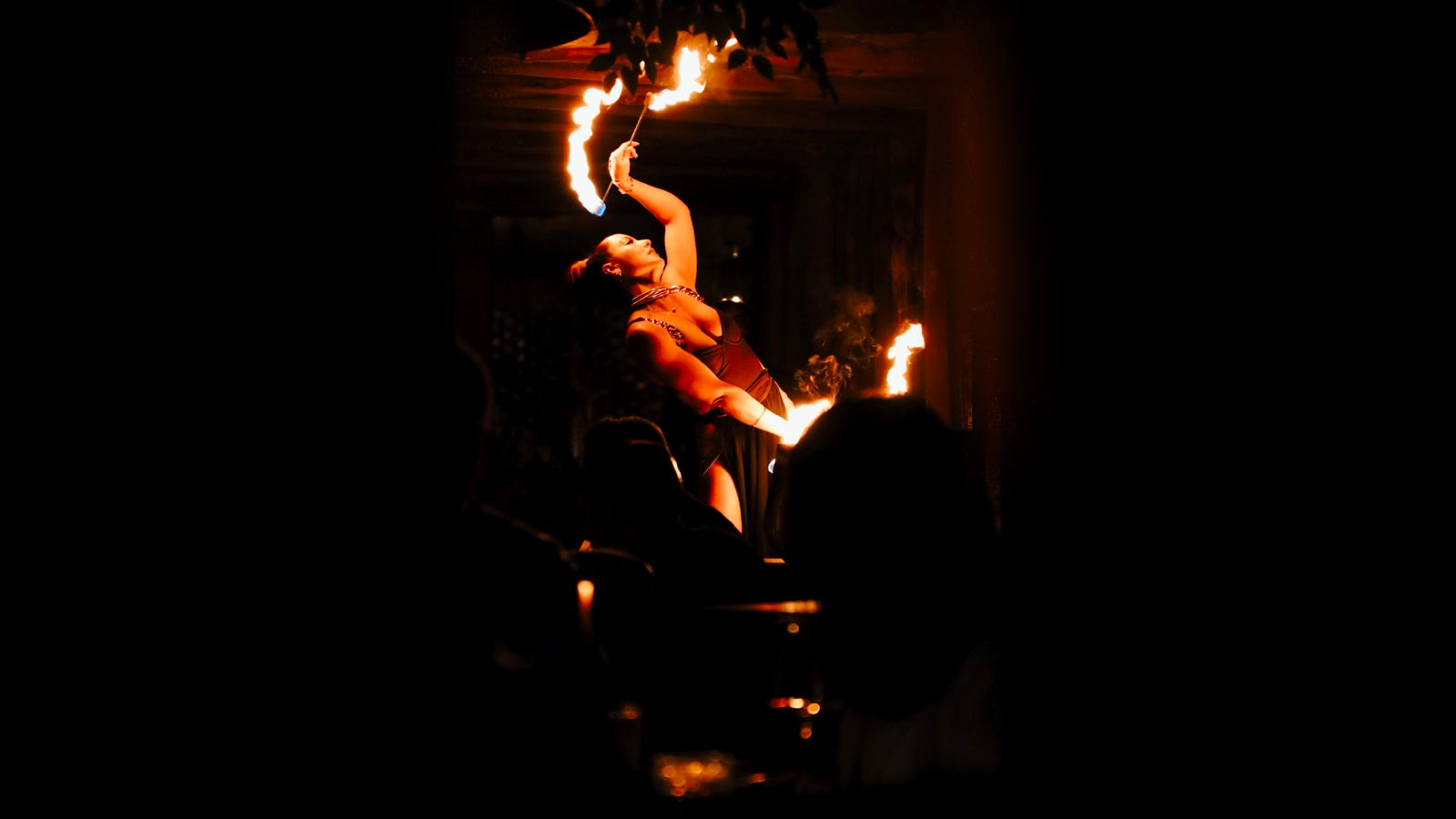 sexy firedancer with batons of fire