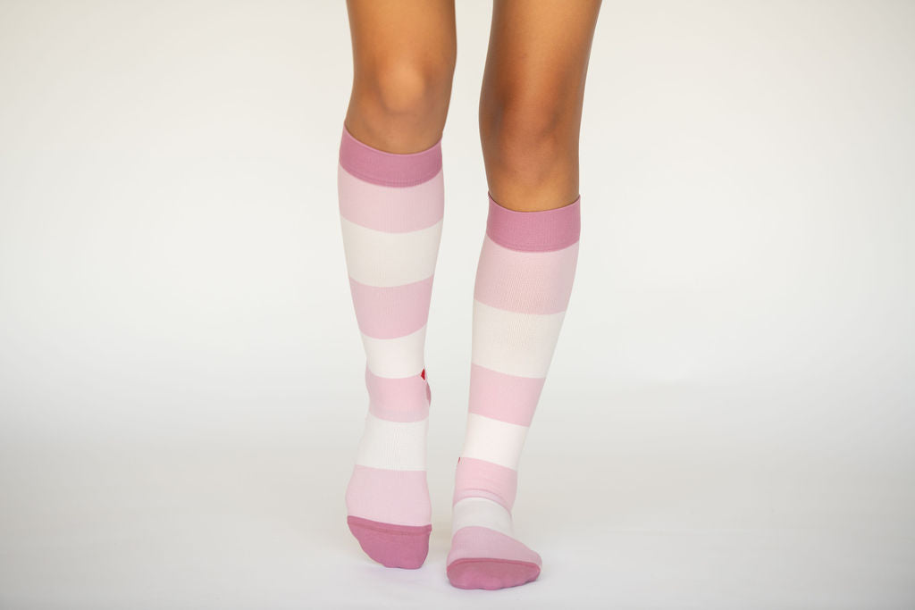 compression socks with blush and mauve stripes with darker blush/mauve accents